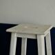 Old white wooden handle stool