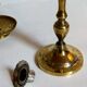 Duo of solid brass and gold metal candle holders worked old