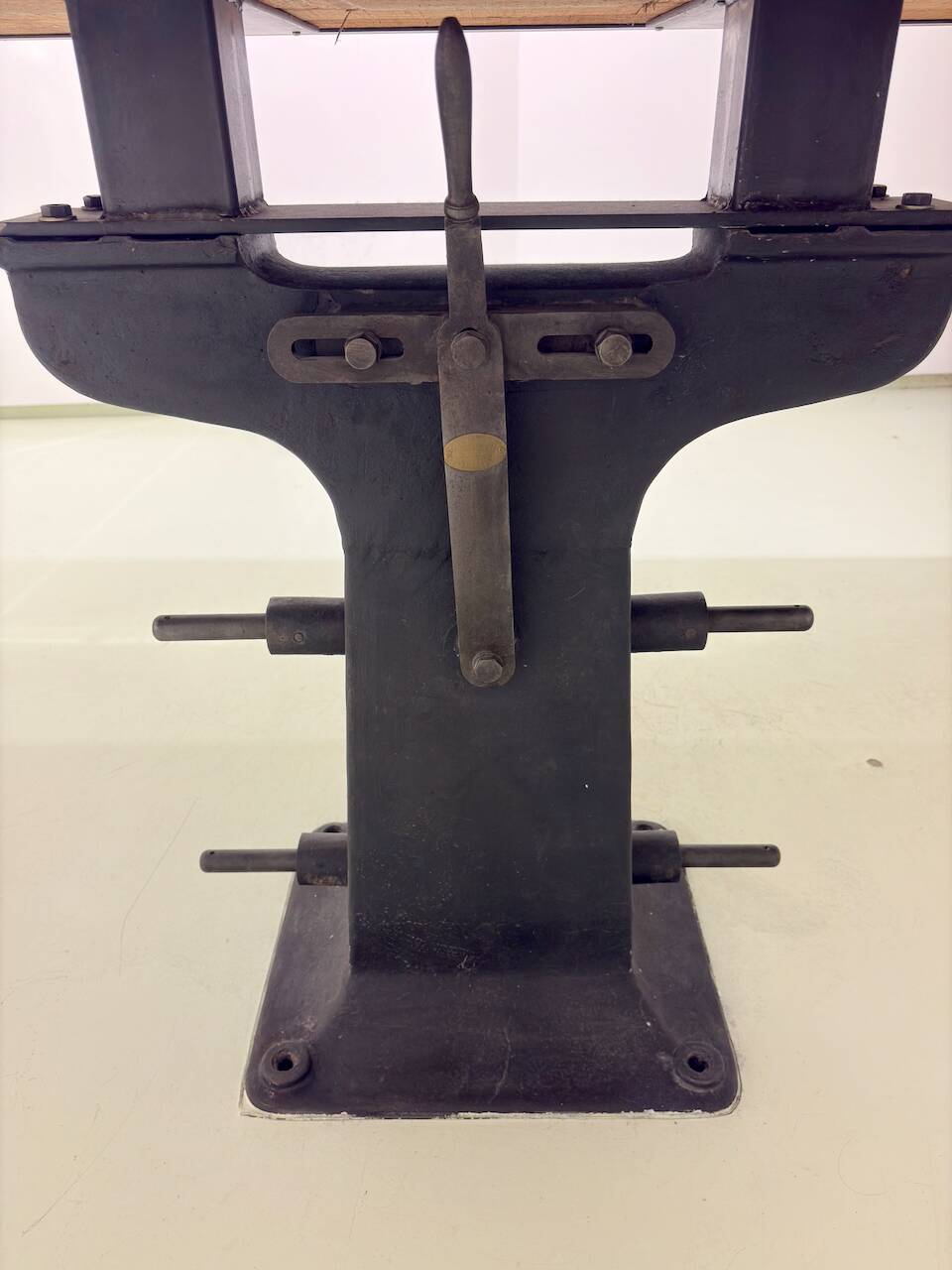 Industrial table with cast iron legs.