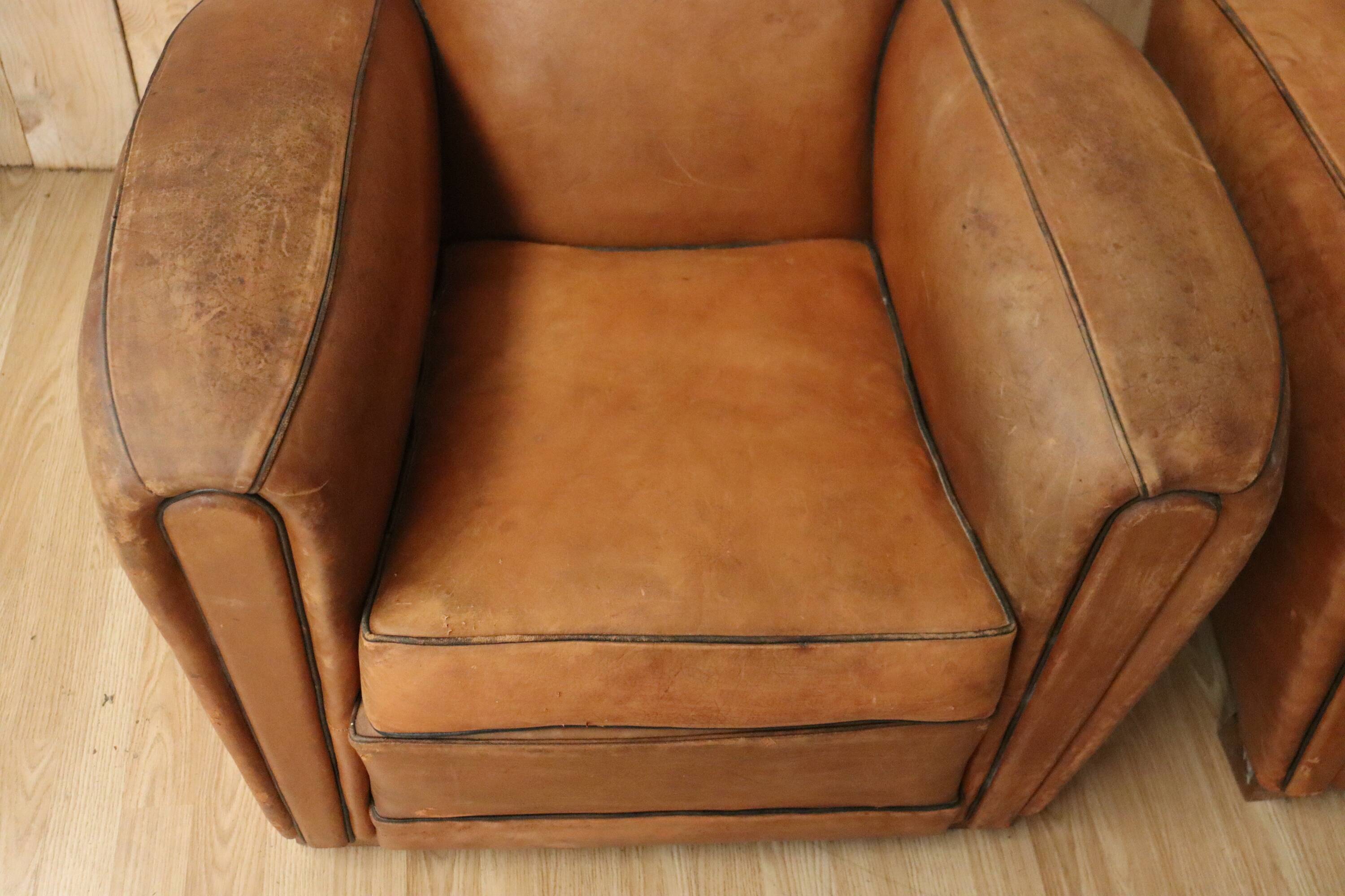 Pair of Art Deco leather club armchairs from the 1930s.