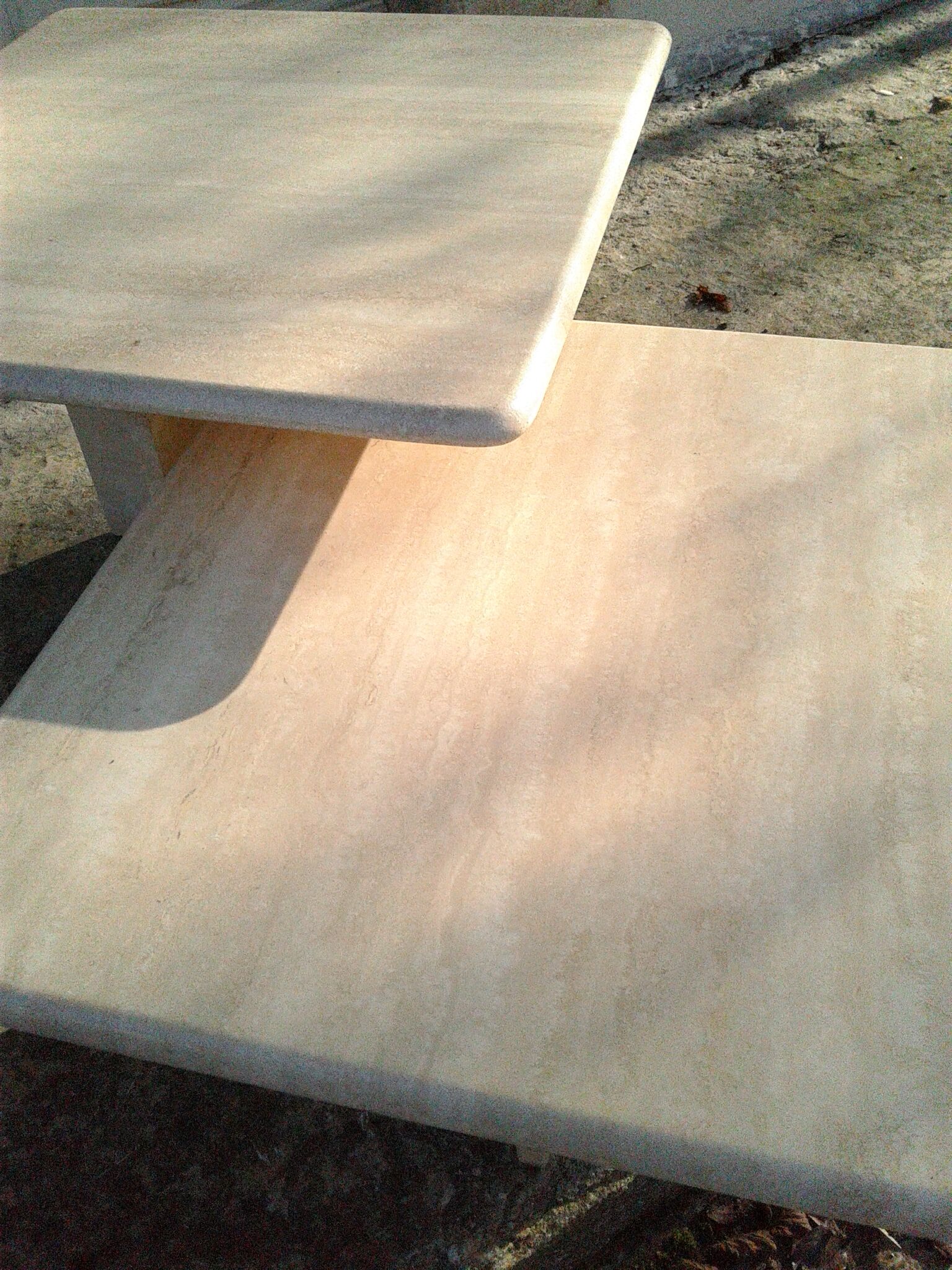 Two coffee tables giggle in travertine