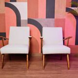 Vintage beige bouclé armchair with walnut wood from the 1950s.