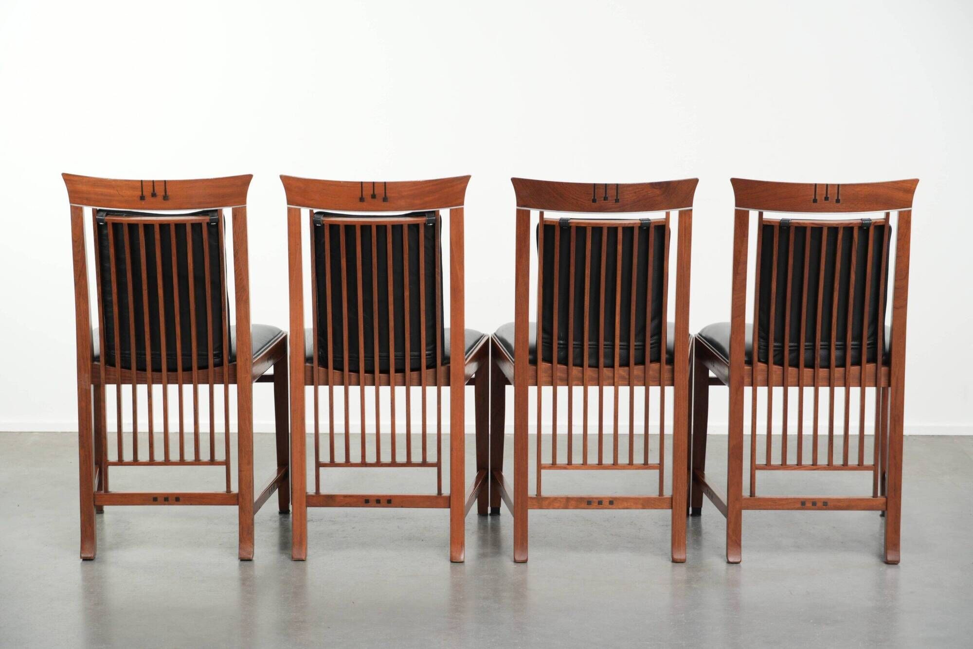 Elegant set of four black cowhide and wooden Art Deco dining chairs