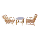 Vintage rattan garden furniture with cushions.