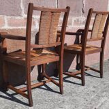 Pair of oak armchairs with straw seats and backs.