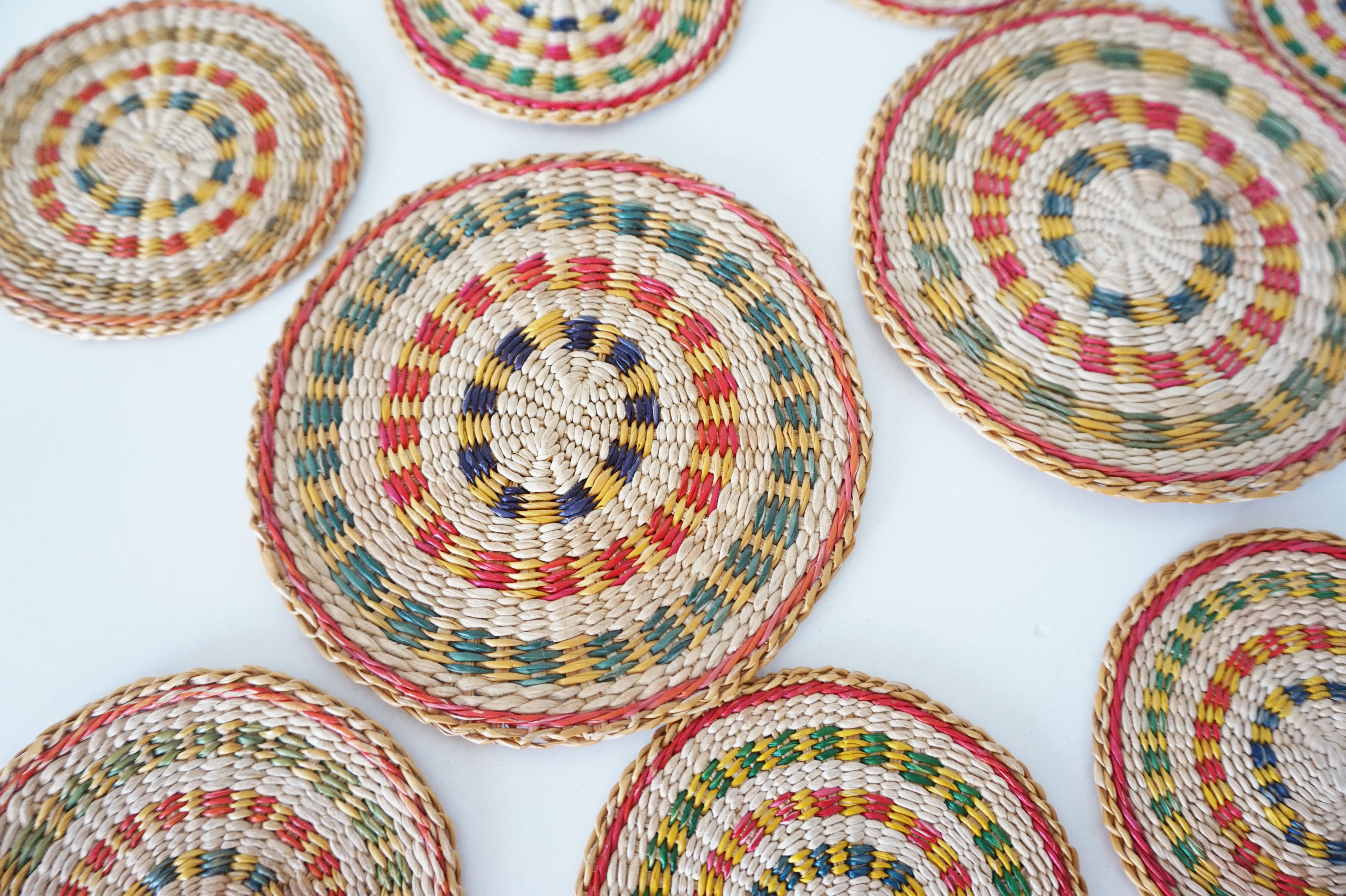 Set of coasters and bottles in colored wicker