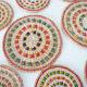 Set of coasters and bottles in colored wicker