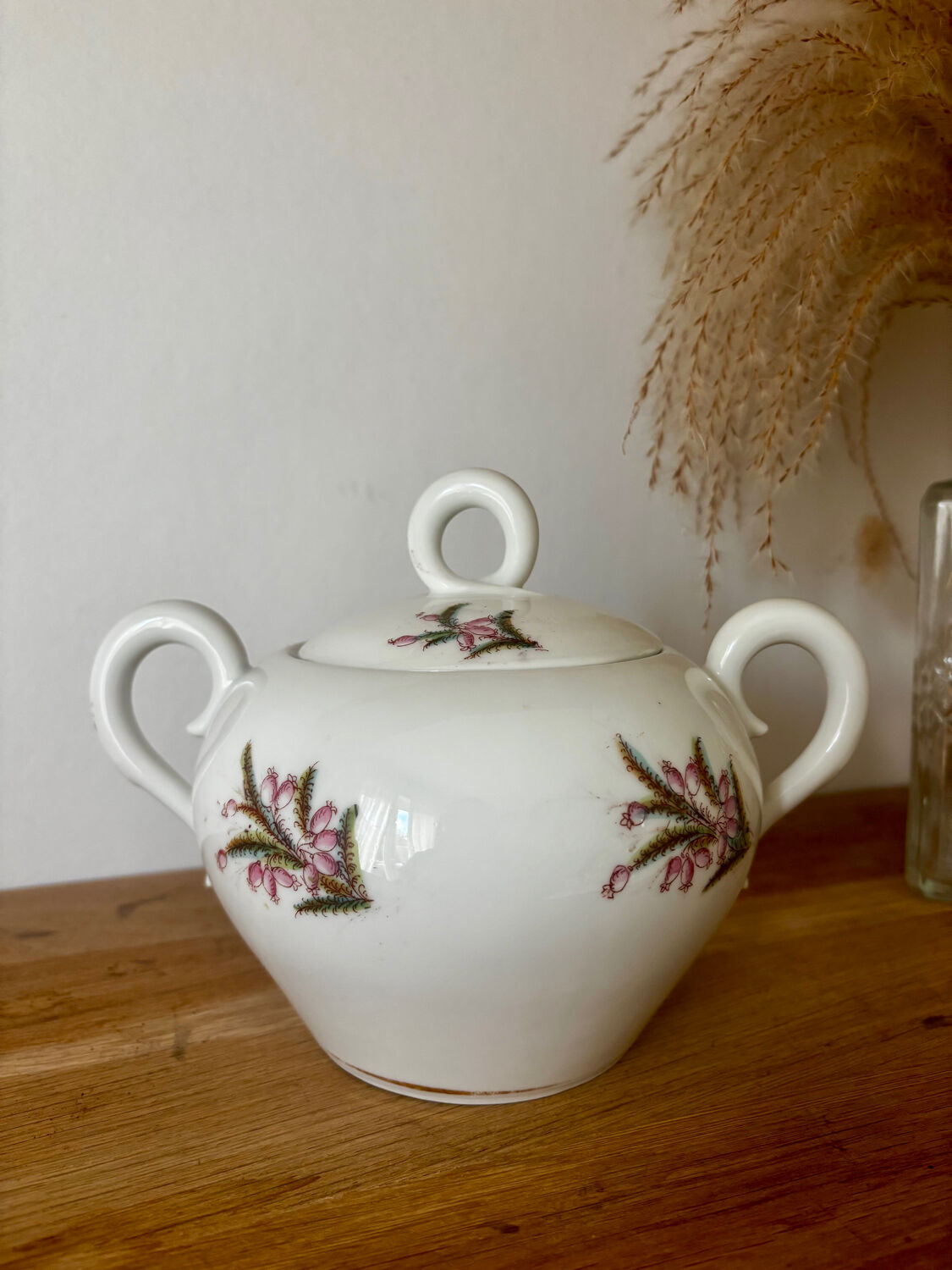Beautiful vintage porcelain sugar bowl with a floral pattern.