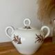 Beautiful vintage porcelain sugar bowl with a floral pattern.