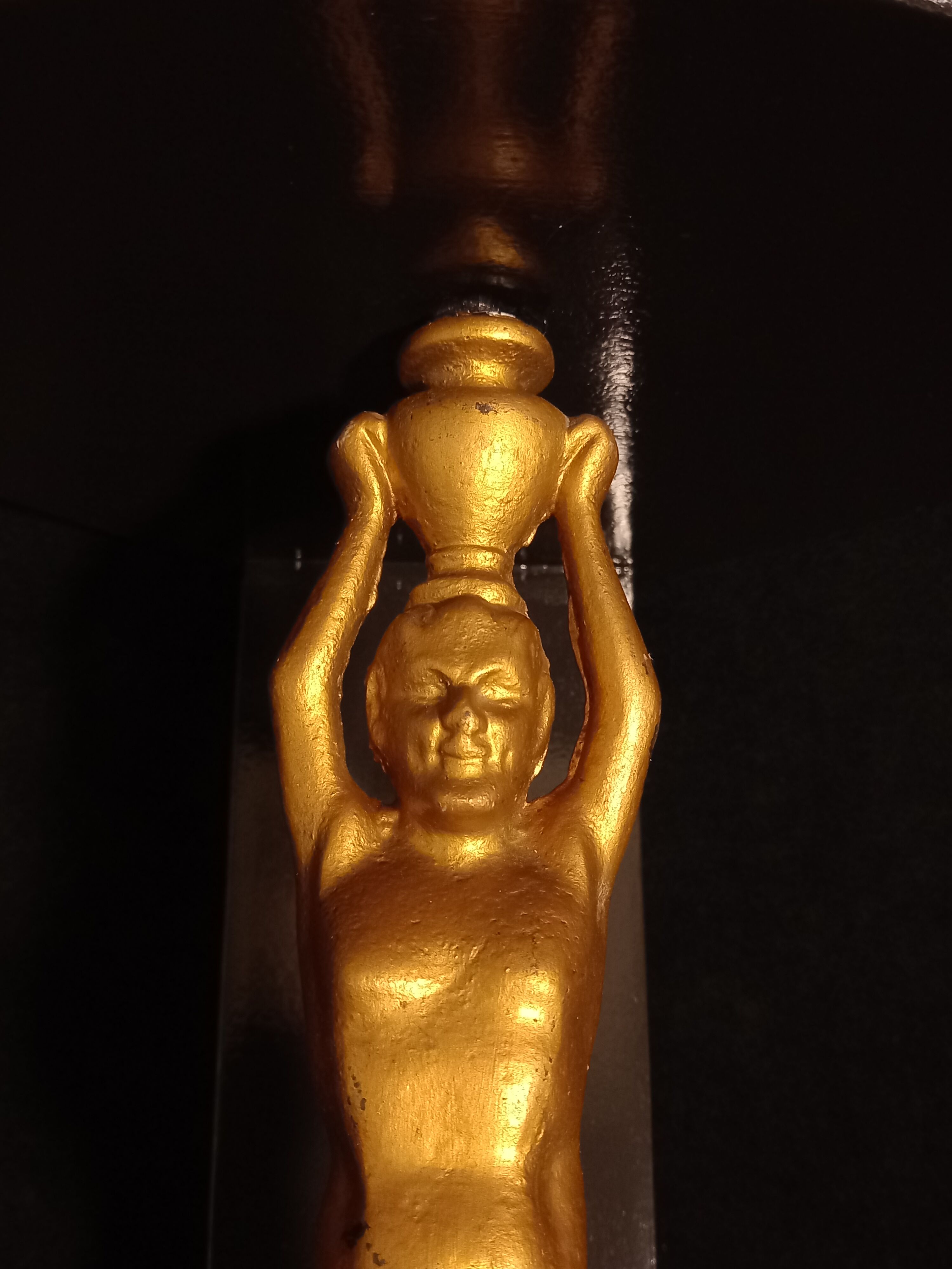 Corner wall lamp console with a golden cast iron djinn