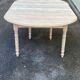 Renovated Louis Philippe round extendable dining table with 4 leaves.