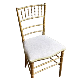 Napoleon III chair in gilded bamboo wood and beige cotton.