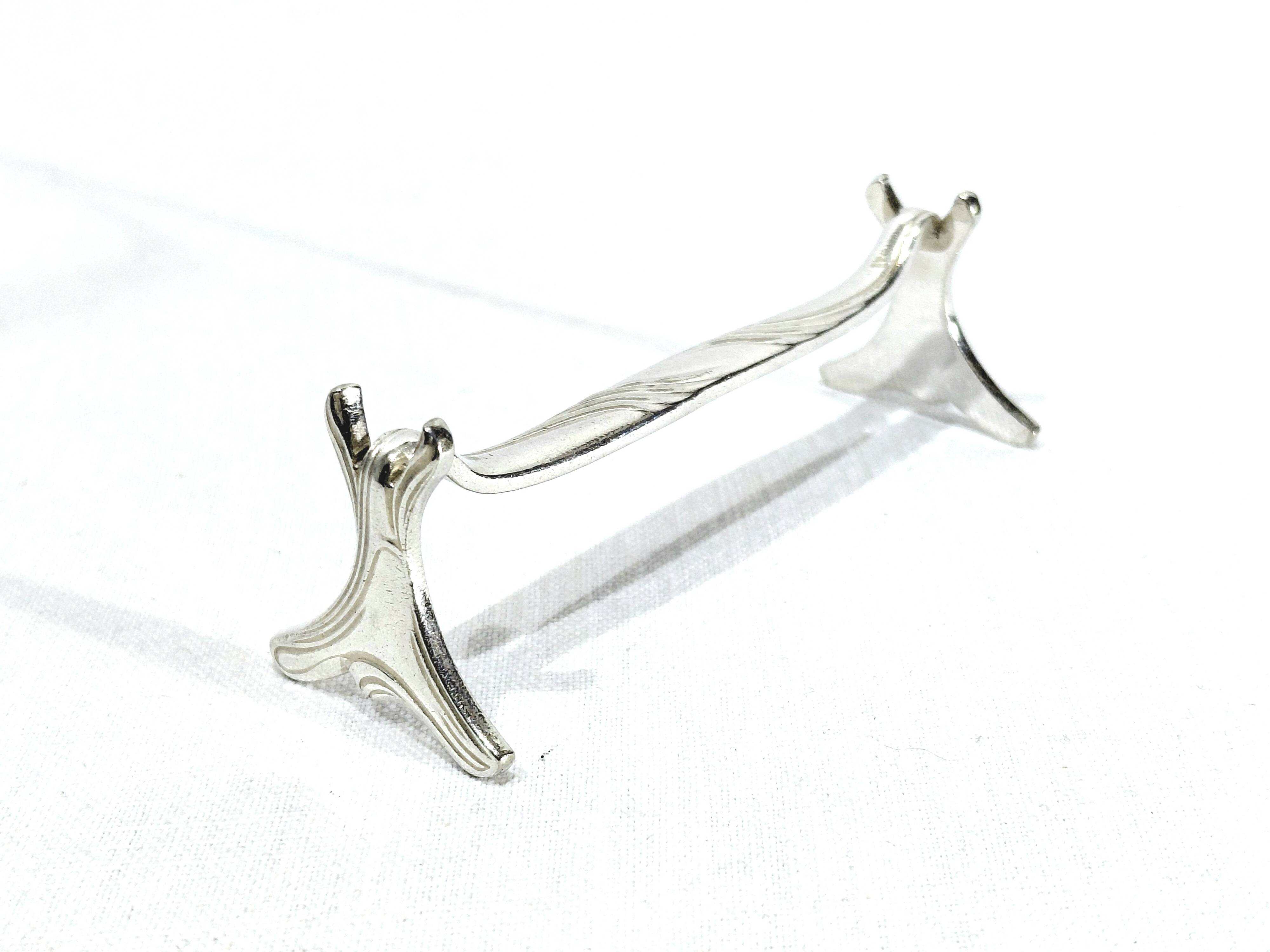 CHRISTOFLE - SET OF 11 SILVER-PLATED KNIFE RESTS