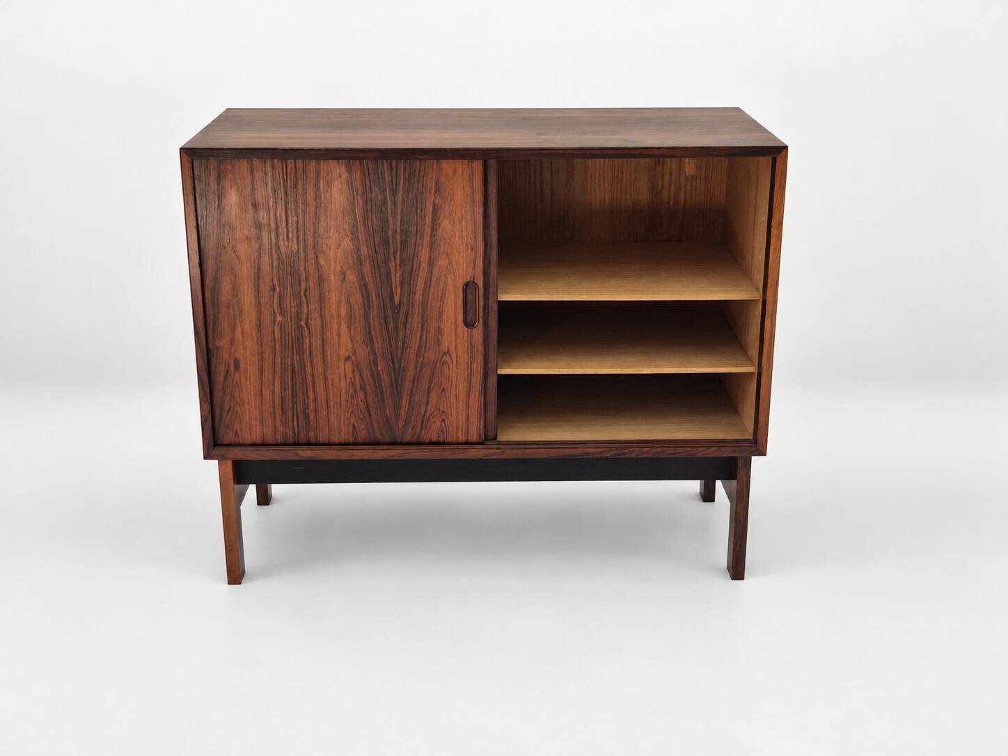 Low sideboard in rosewood with sliding doors. Denmark, 1960s