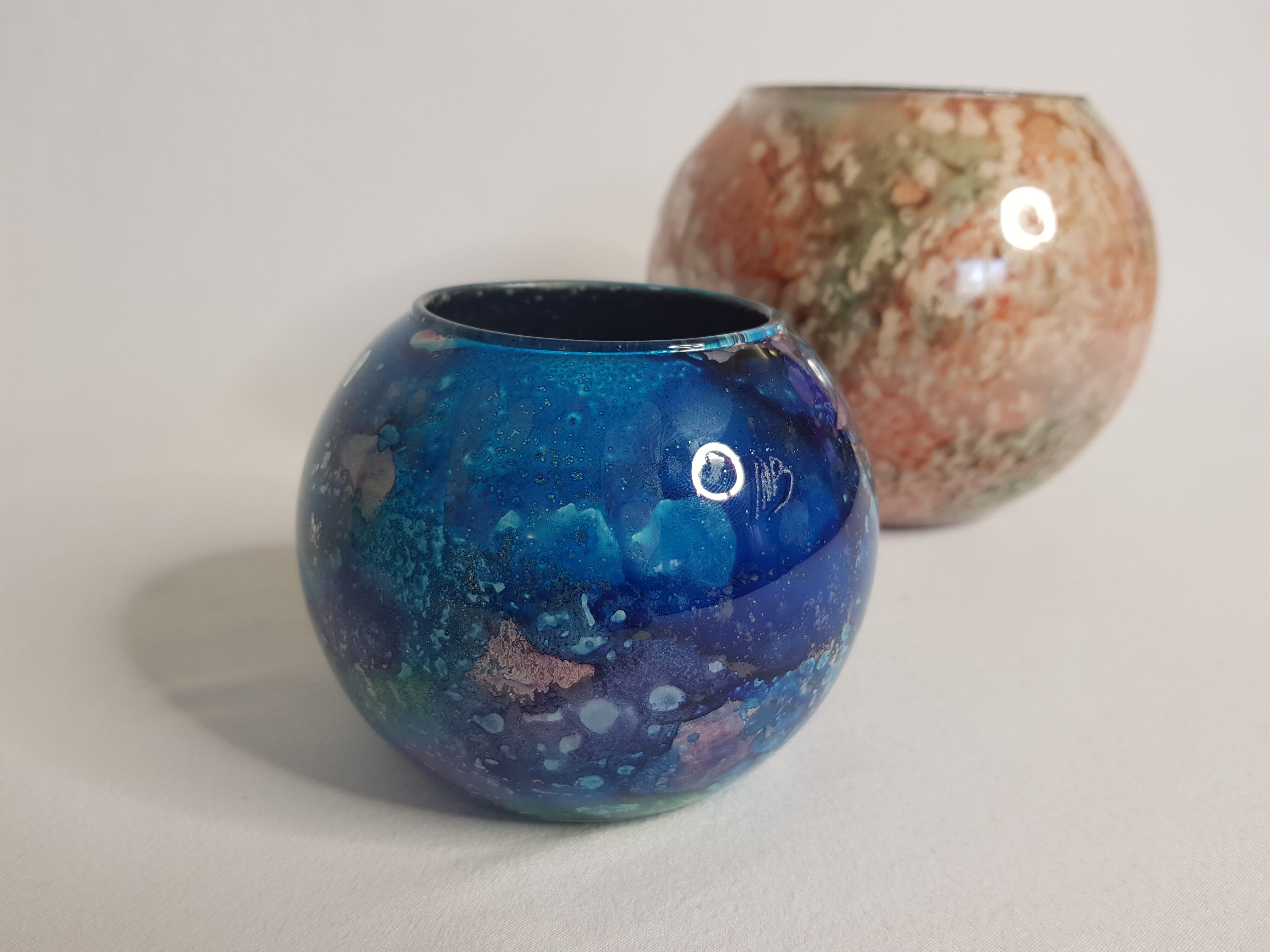 Set of two hand lacquered glass ball vases signed "Laque Line" and "Jean-Noel Bouillet"