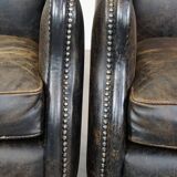 Set of 2 black cow leather armchairs finished with decorative nails, industrial style