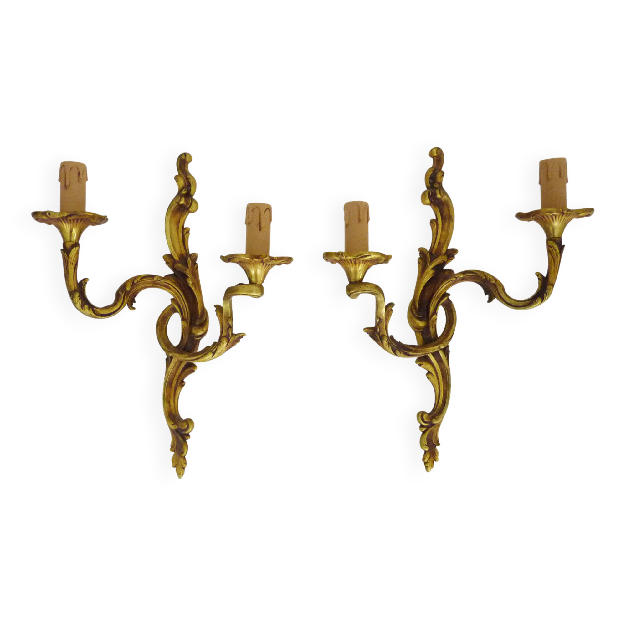 Antique pair of double-light bronze wall sconces with acanthus leaves. 1950s