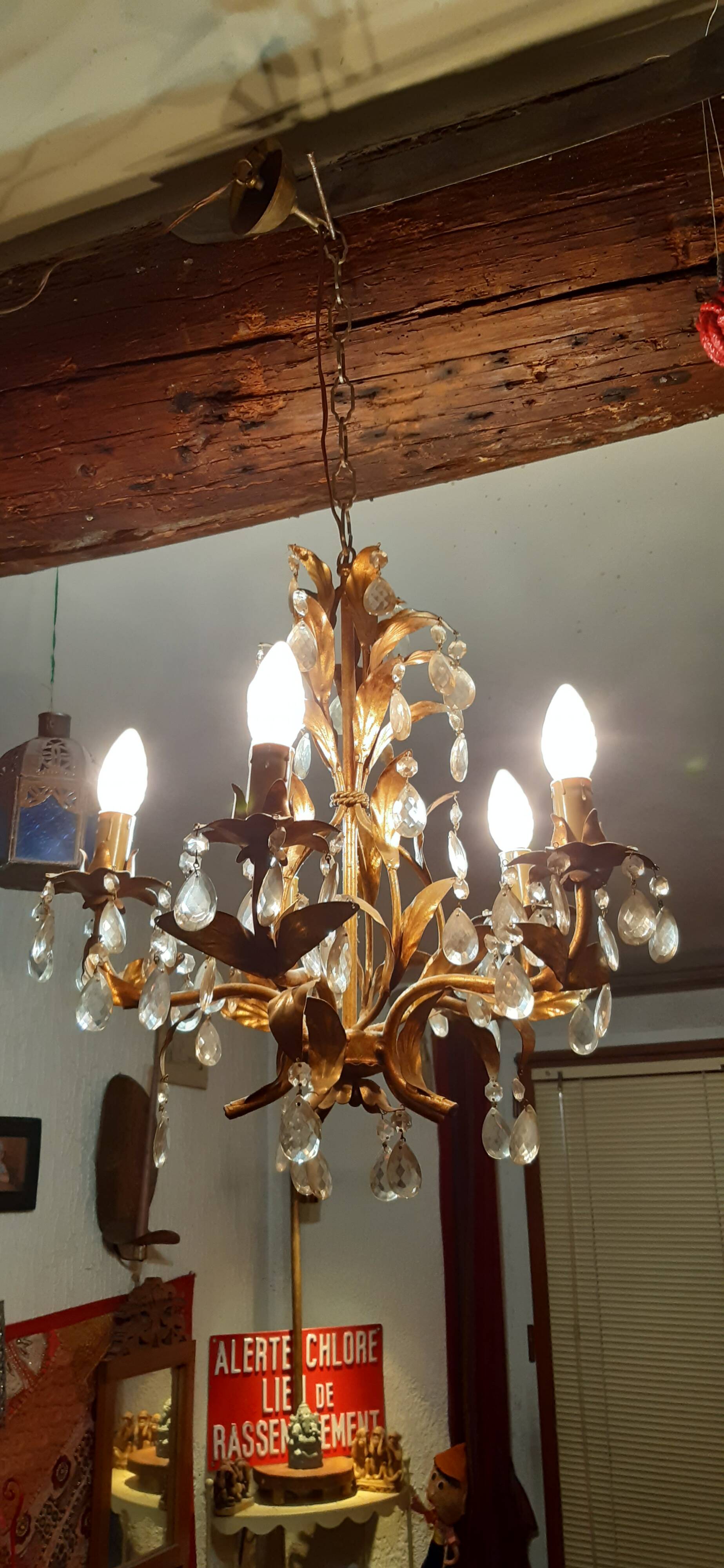 Very pretty chandelier with tassels and leaves in gold sheet metal.