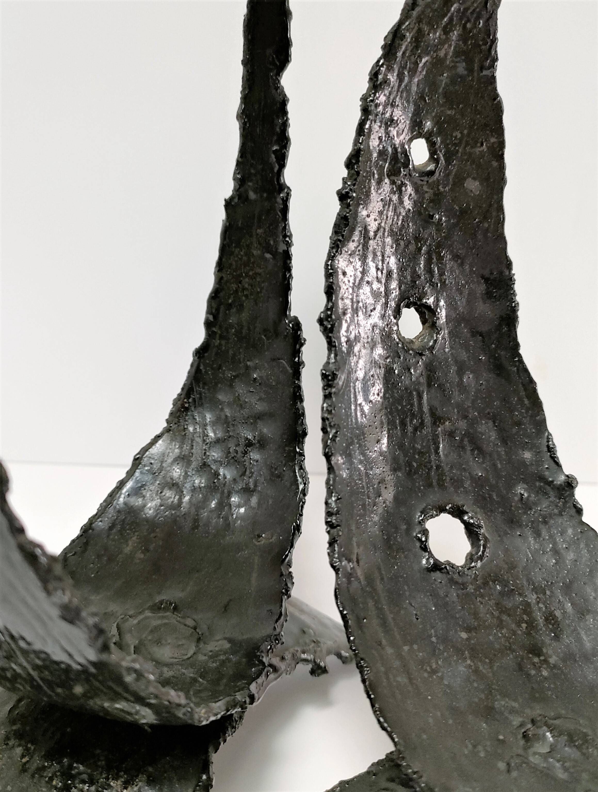 Pair of brutalist design metal candlesticks