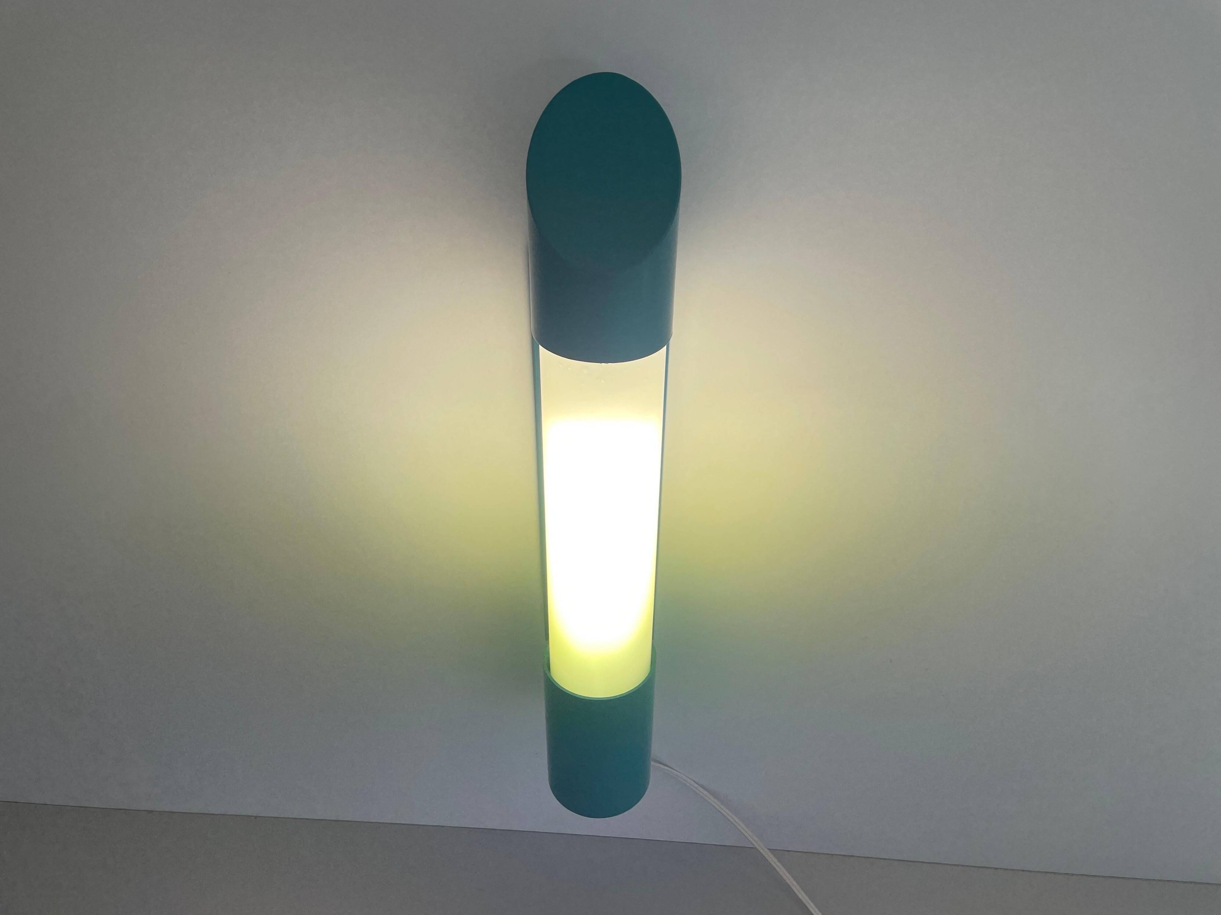 Simple cylindrical wall light in opal glass and turquoise metal, 1970s, Germany