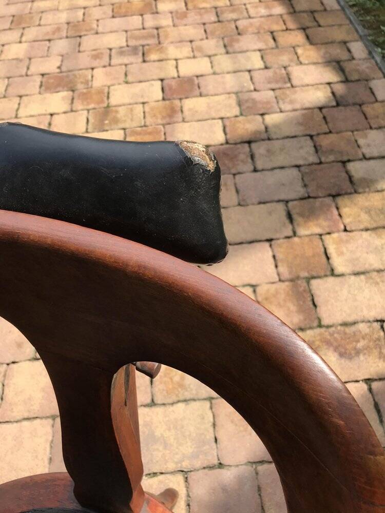 Pair of antique brown swivel armchairs in upholstery fabric, wooden frame, Hungary circa 1900.