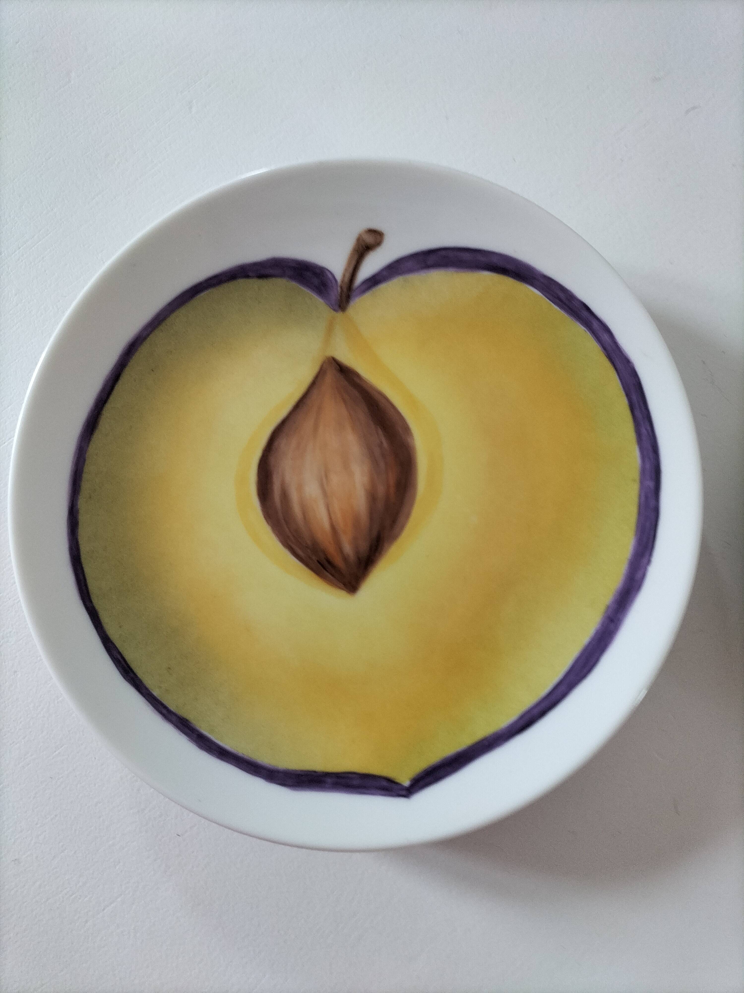 5 hand-painted dessert plates with stylised fruit designs.