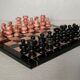 Small chessboard in coral marble and black marble - Italy - Second half of the twentieth century