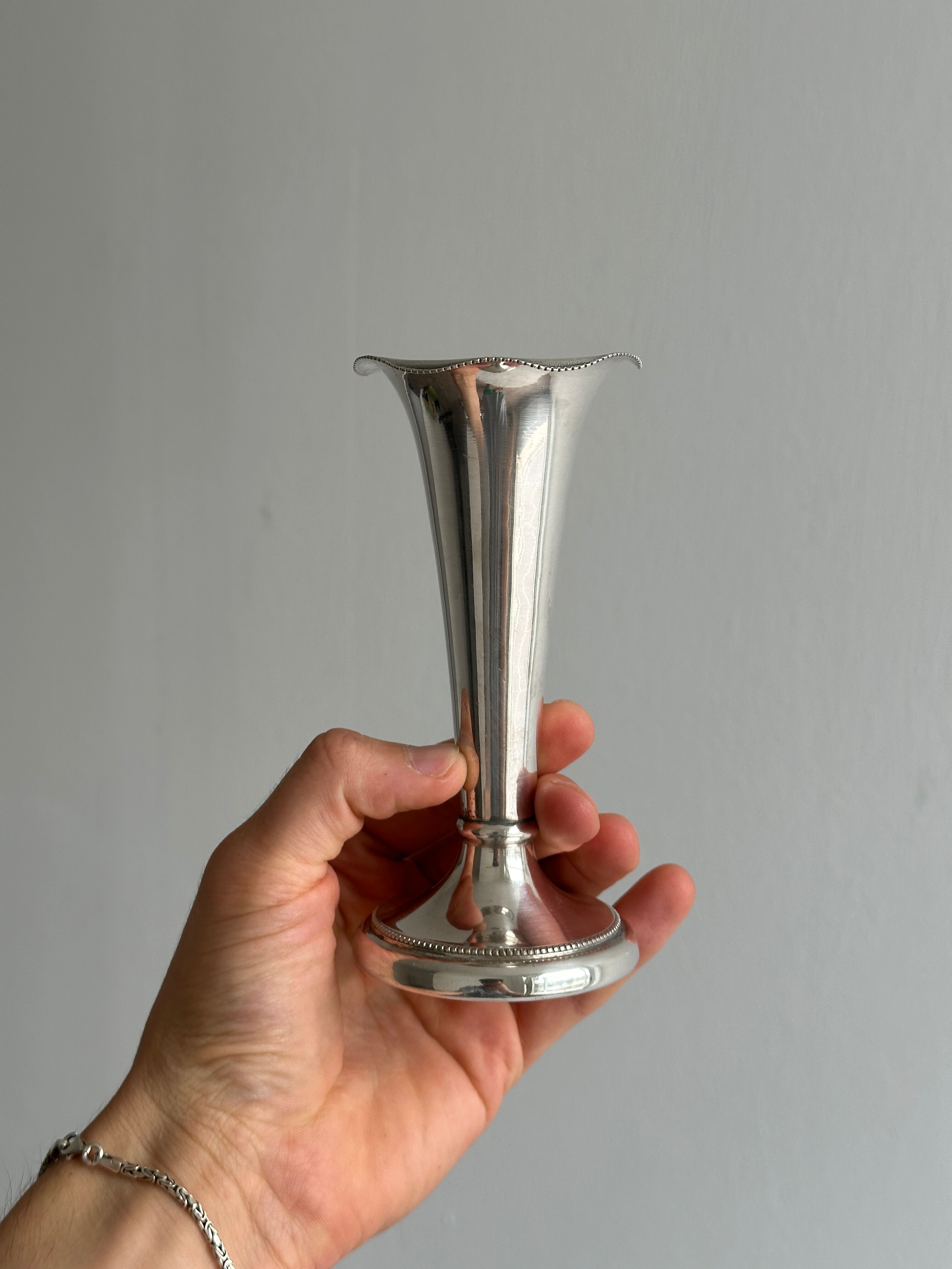 small antique silver-plated metal vase