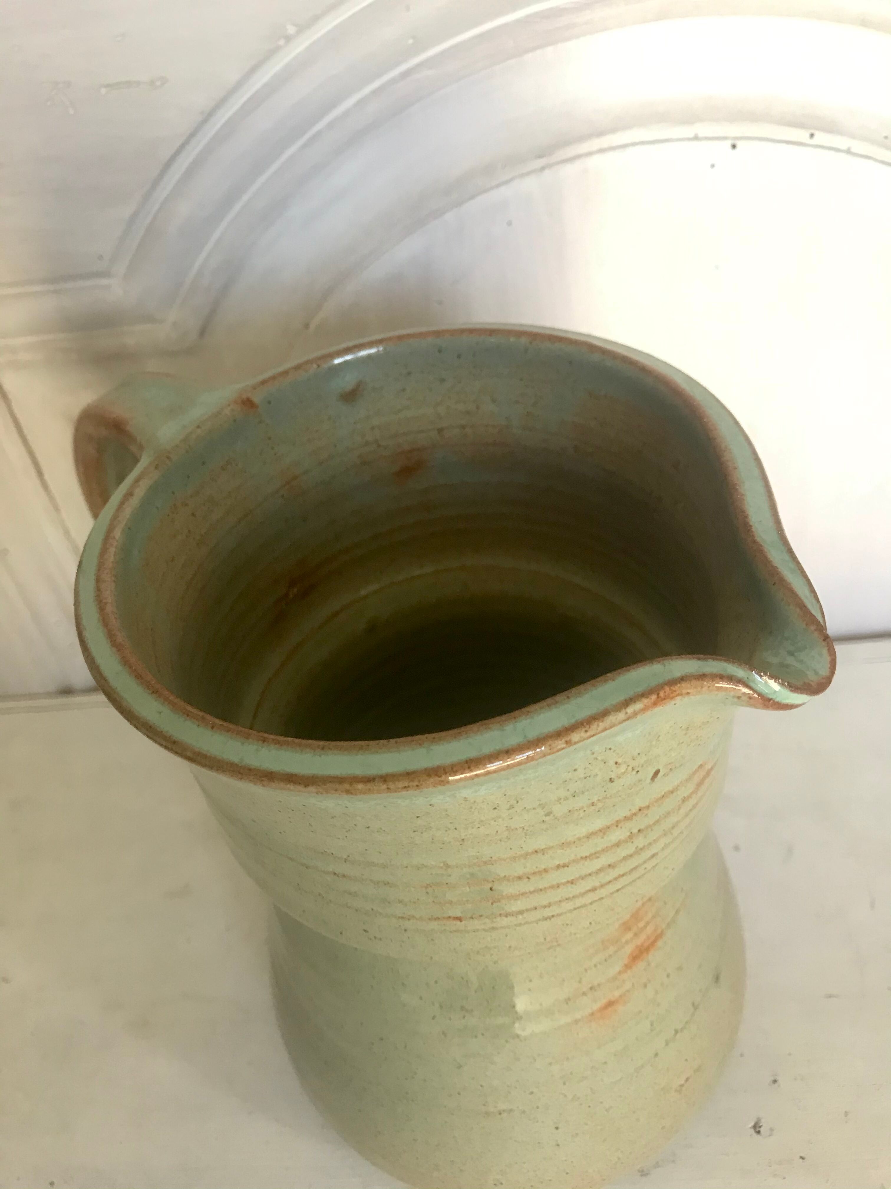 Pitcher and its vintage sandstone glasses