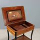 Antique sewing table in various types of wood, 19th century.