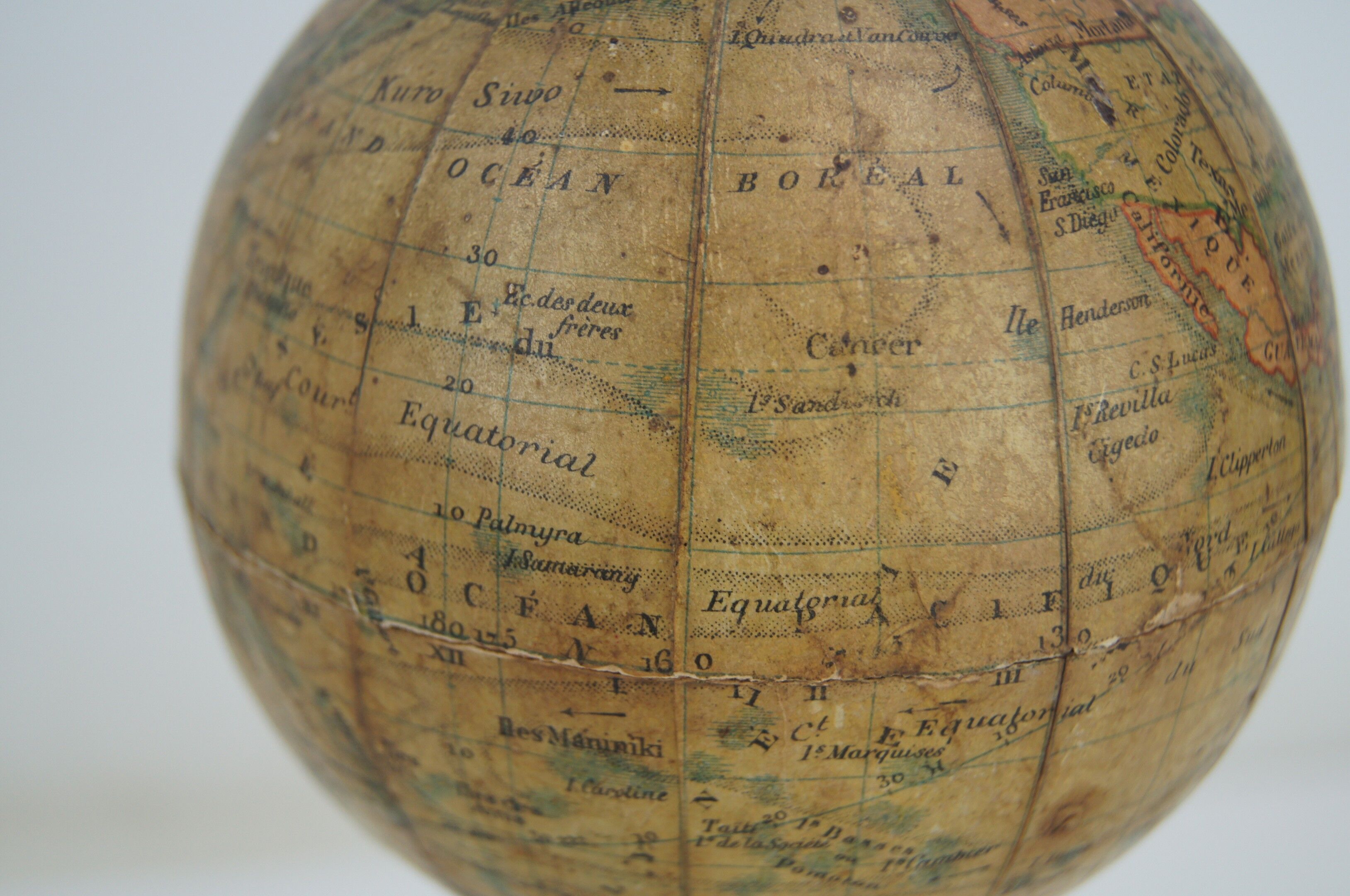 Globe on turned and blackened wooden base