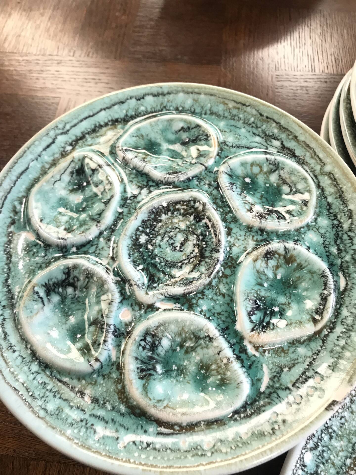 Set of 12 plates and an oyster dish or other in majolica.