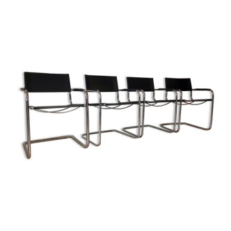Four armchairs in chrome steel tube and black leather