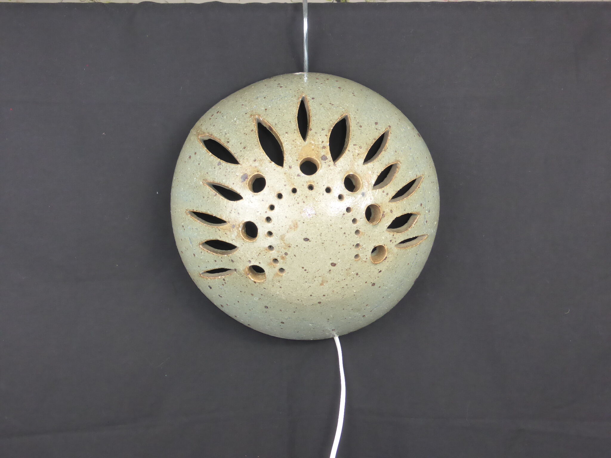 Wall lamp in openwork-vintage round sandstone shape