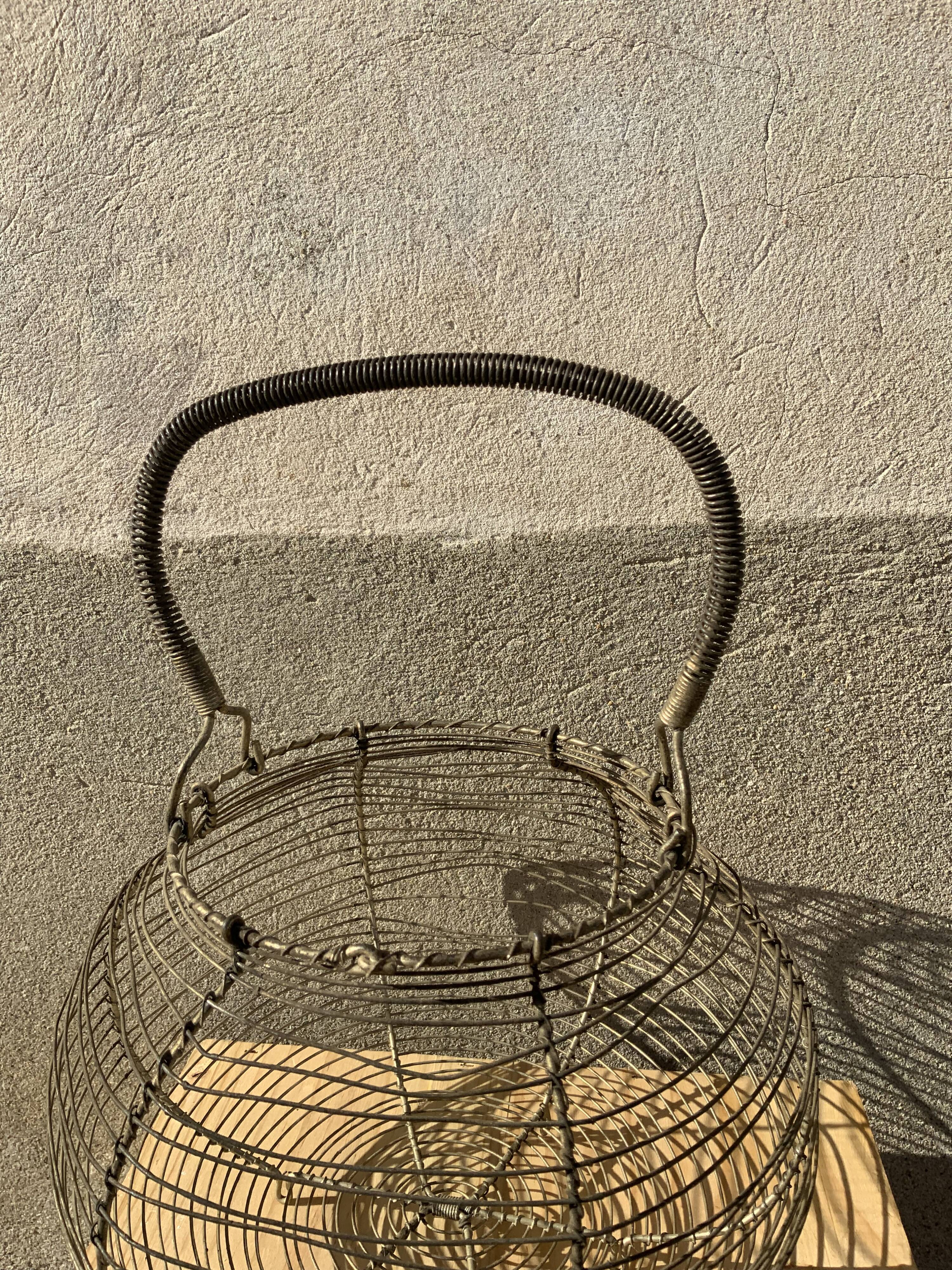 Vintage iron egg basket with hanse antique