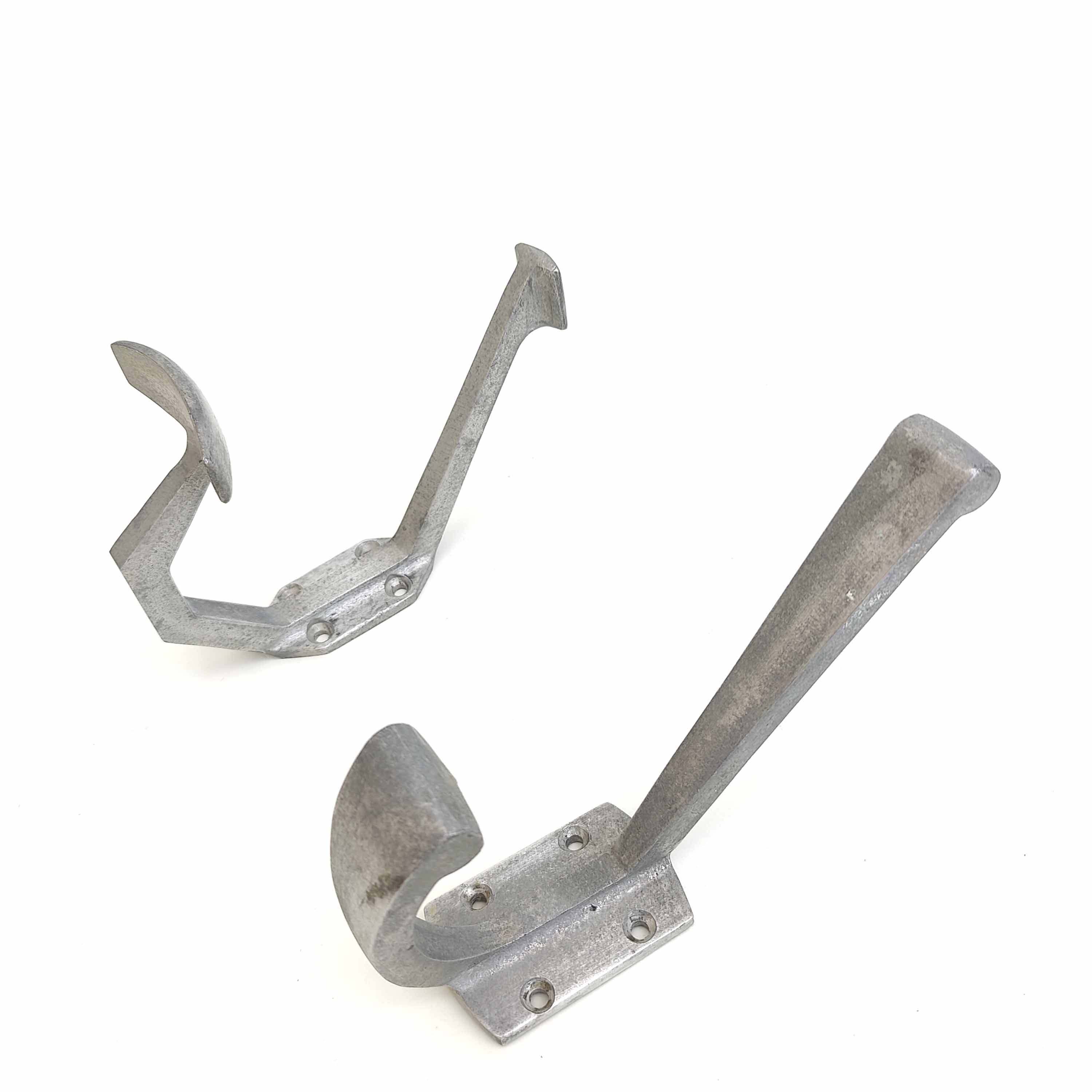 Two mismatched art deco aluminum hooks
