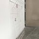 Minimalist white German mid-century coat rack with strings from the 1960s.