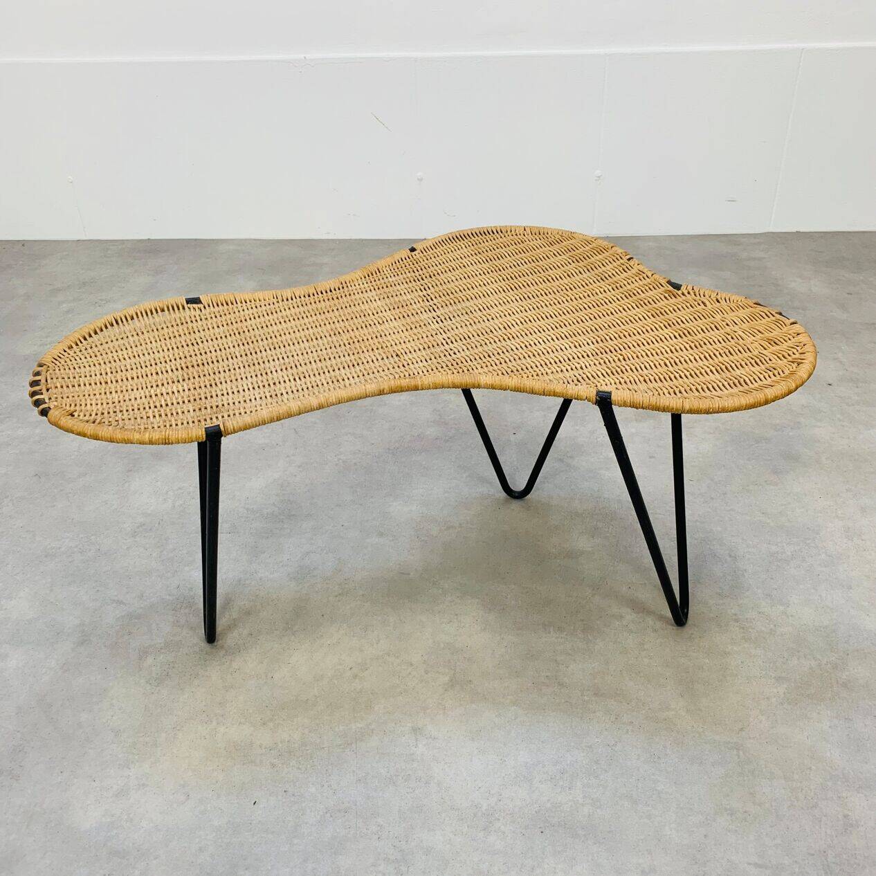 Raoul Guys coffee table, free form, wicker and metal, 1960s.