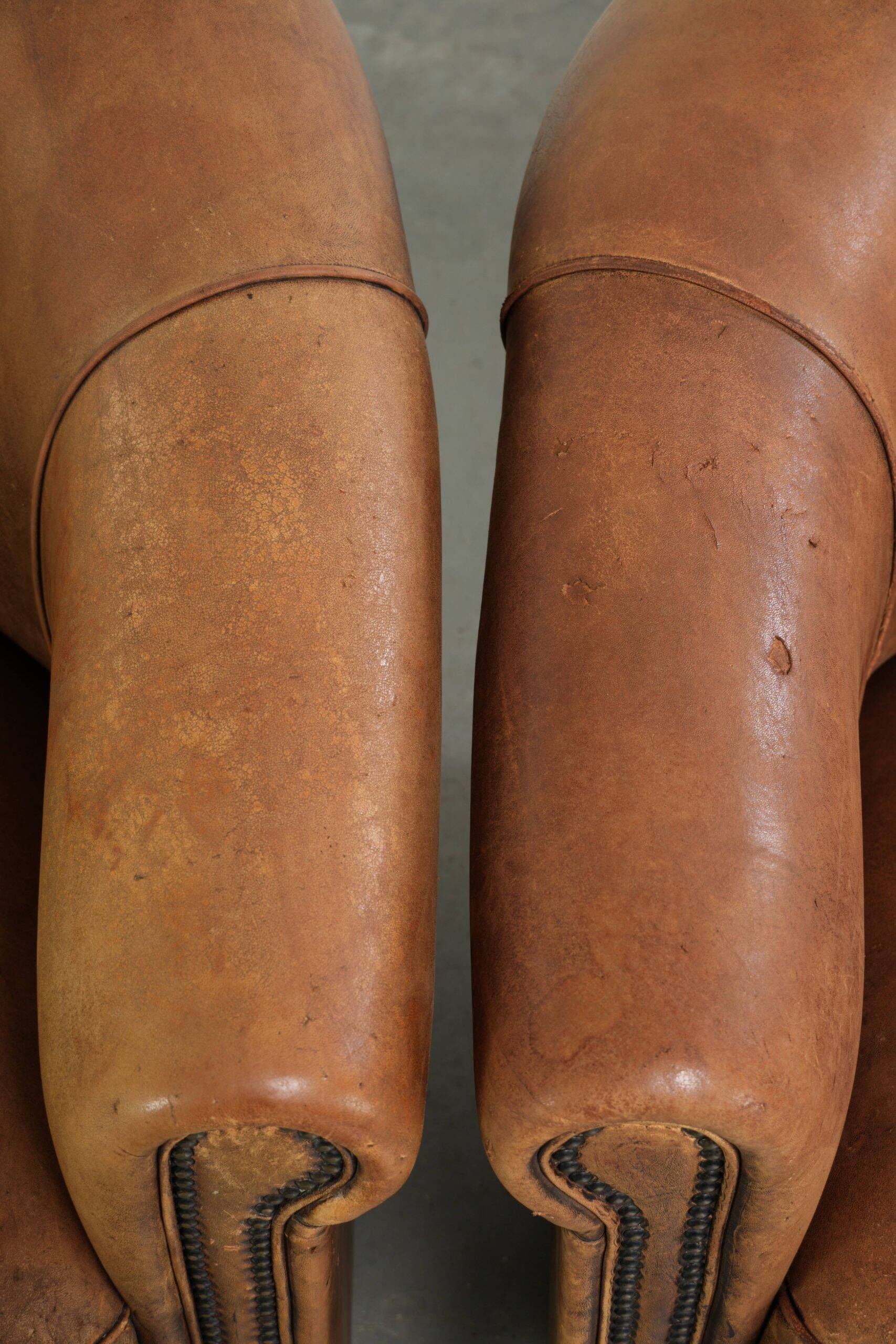 Sturdy set of vintage sheepskin club armchairs with a great appearance
