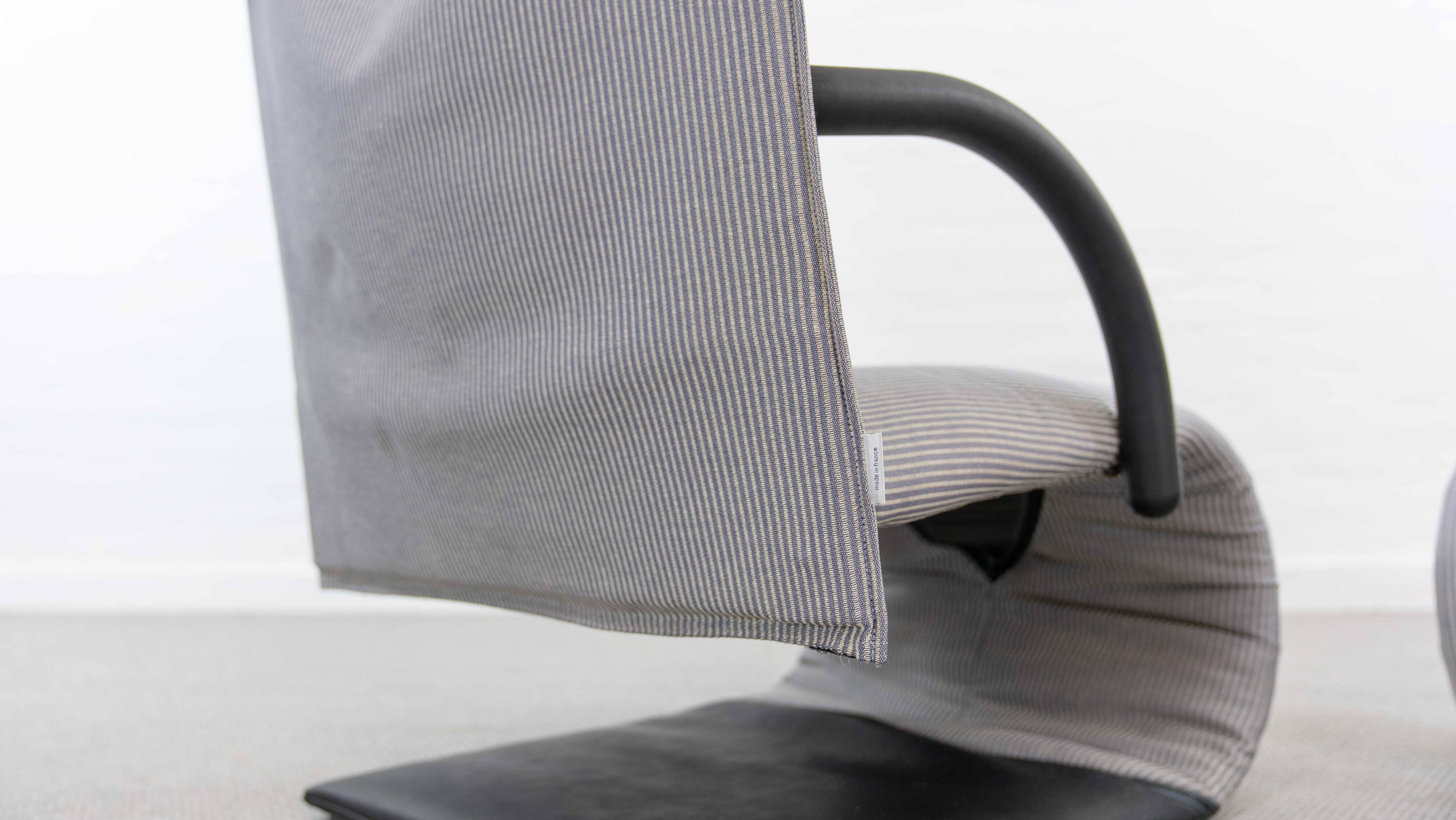 Zen easy chair with footrest by claude brisson for ligne roset