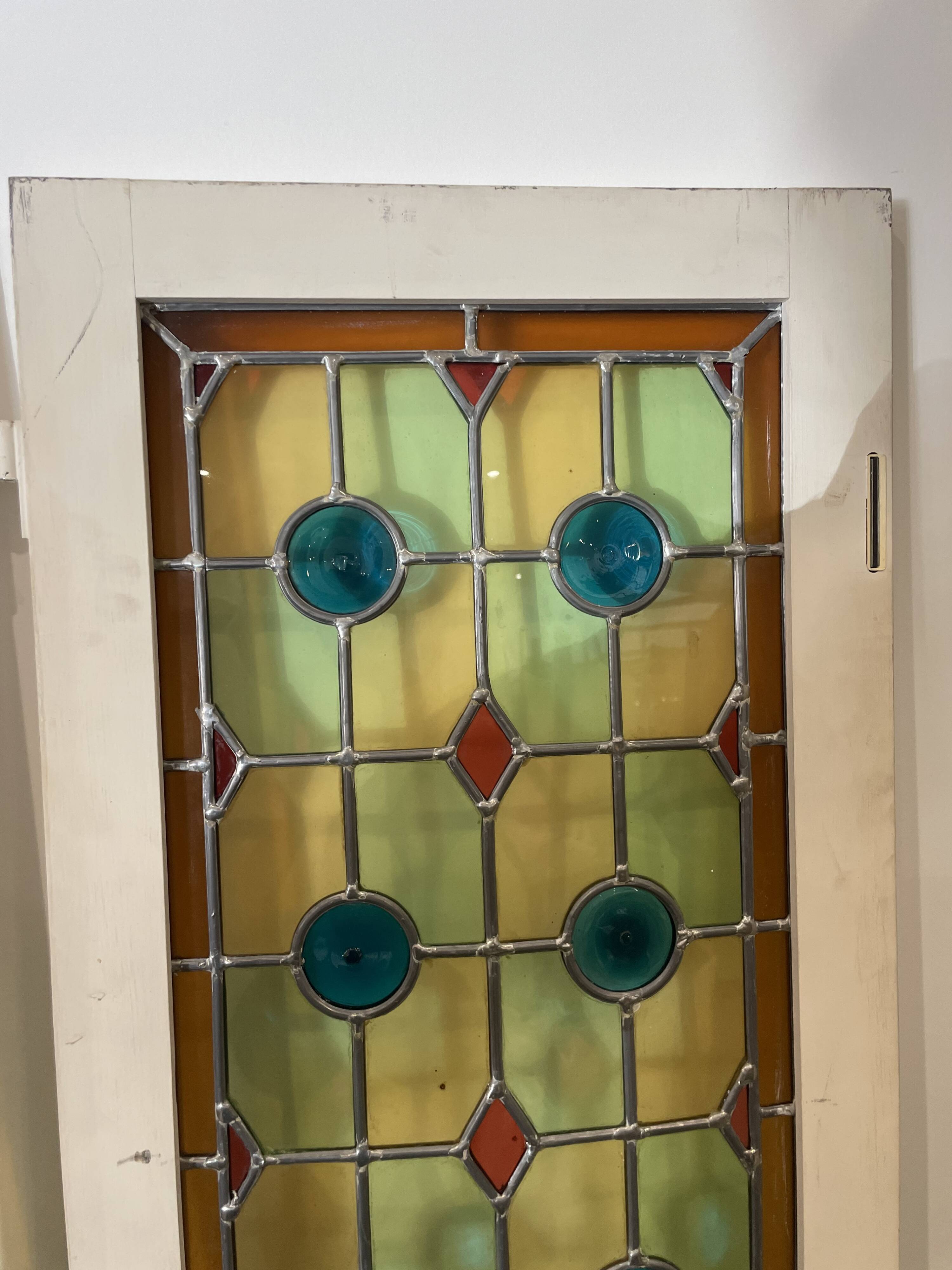 4 vintage faux stained glass panels that can form a screen or a partition