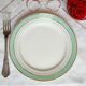 Flat antique earthenware plates with gilded edges