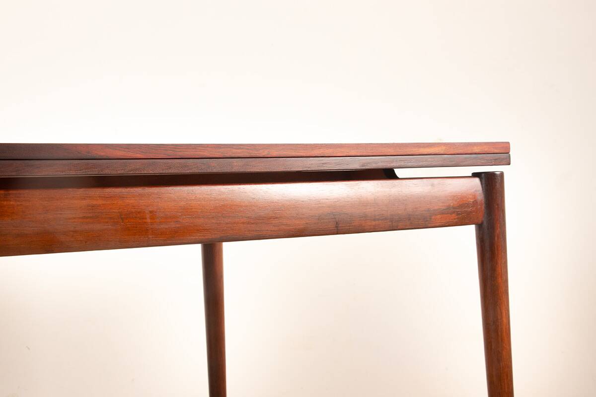 Danish extendable dining table in rosewood and brass by Poul Volther