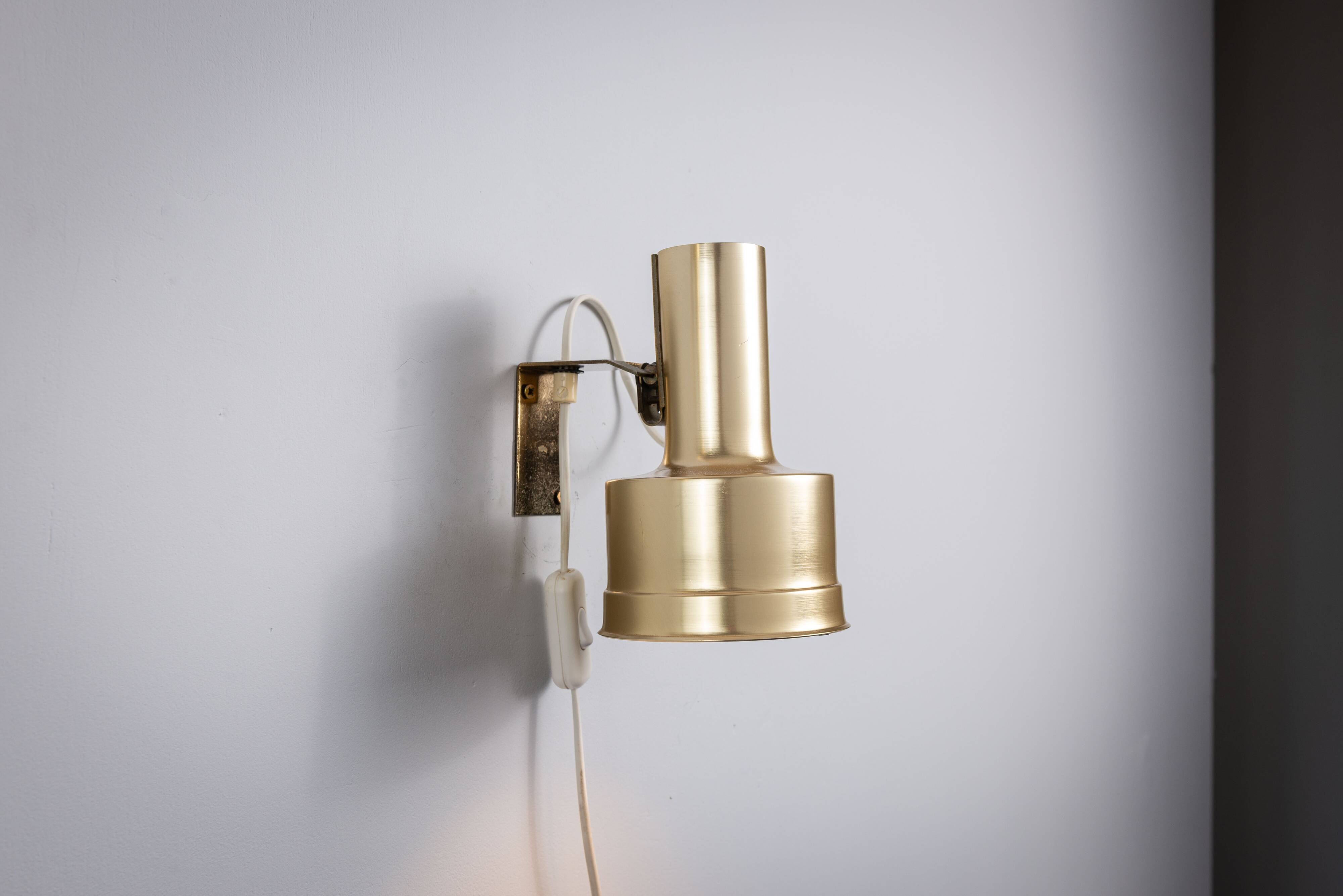 Pair of adjustable wall lamps designed by Per Sundstedt for Kosta Lampan
