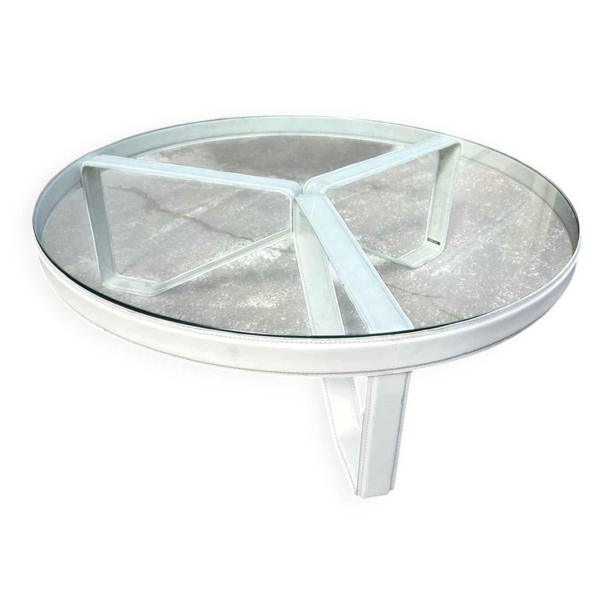 Round coffee table with a metal/leather frame and glass top by Roche Bobois.