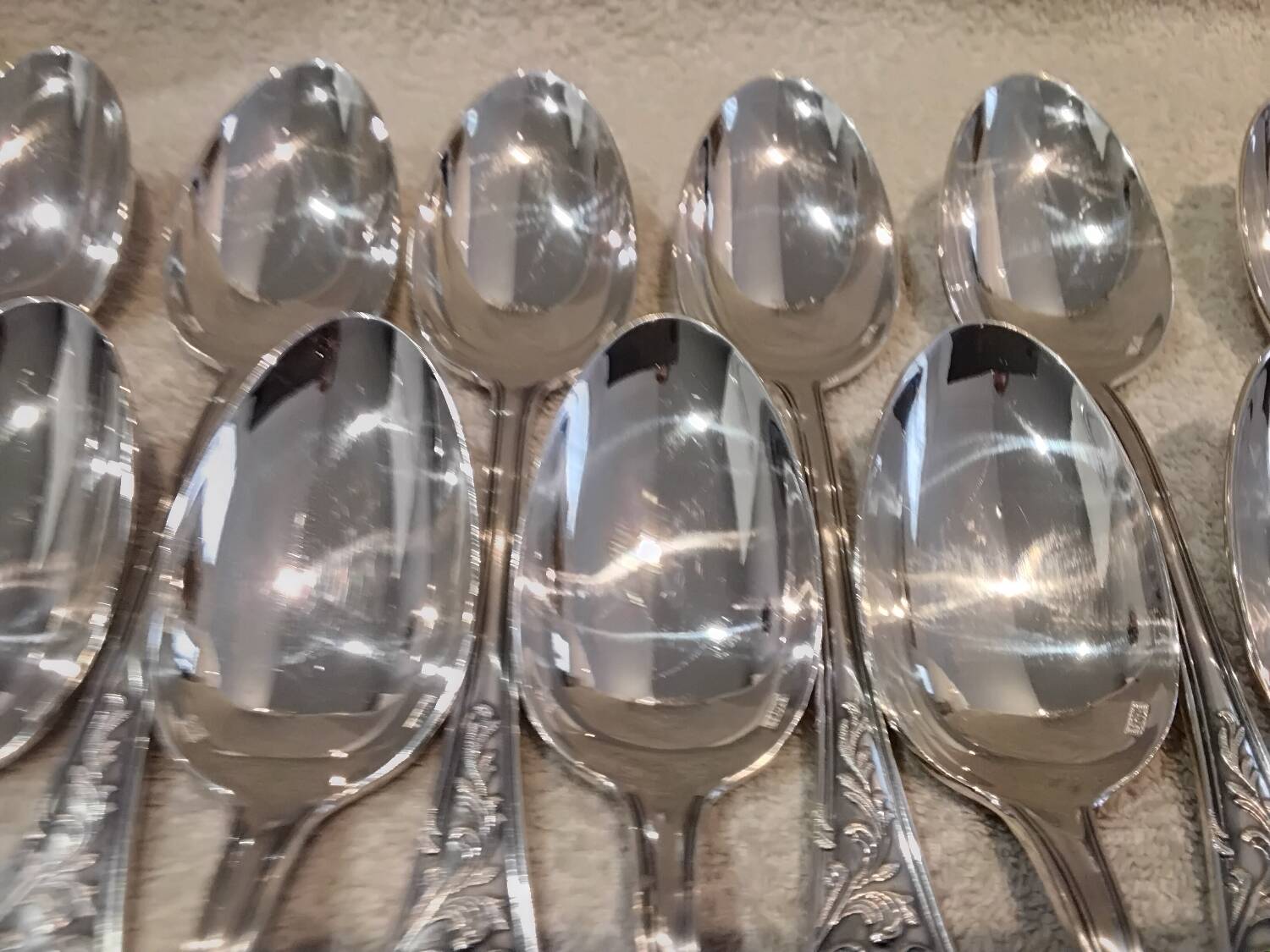 12 silver-plated metal soup spoons, Ercuis Dubarry model.