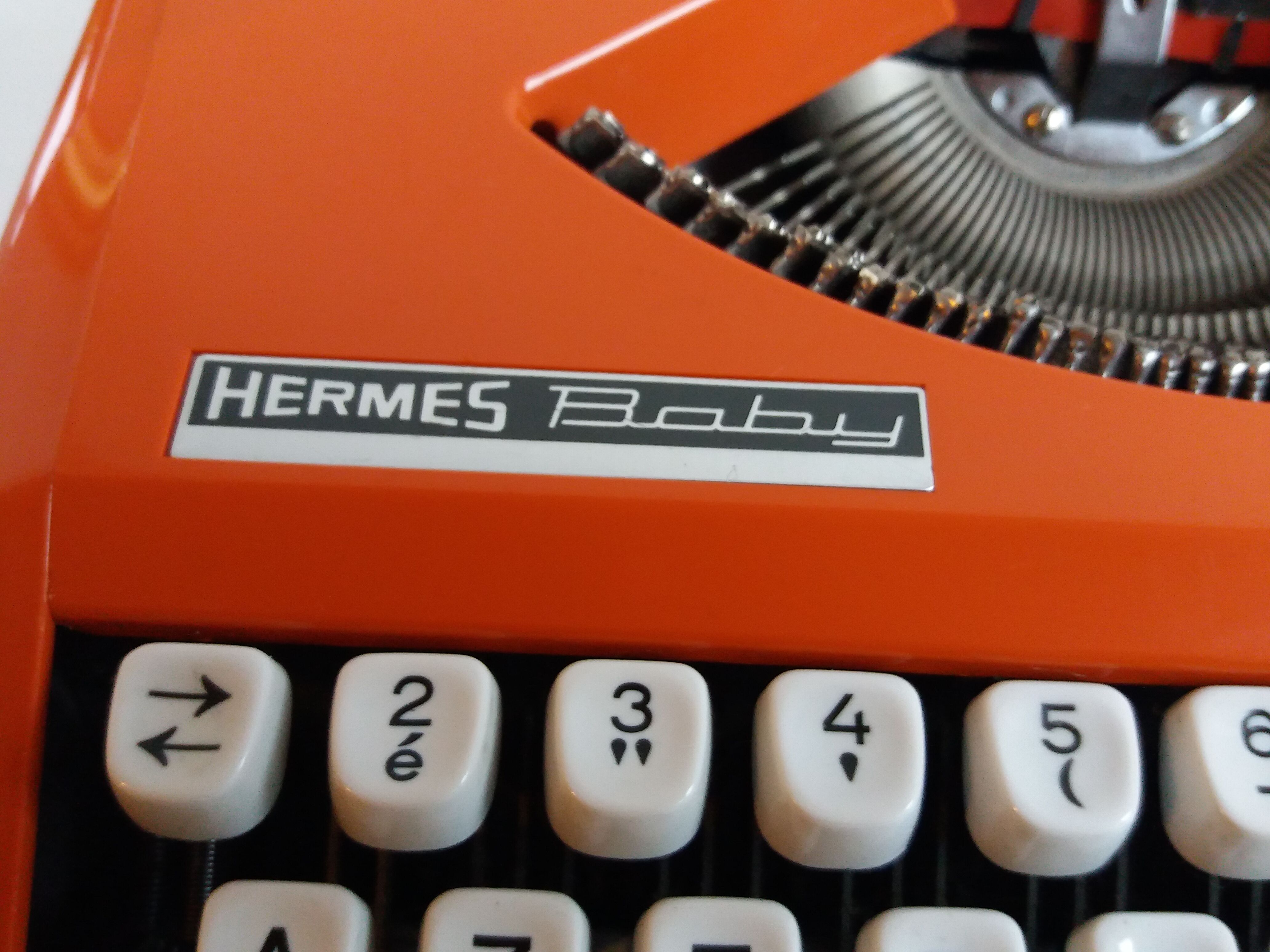 Hermes Baby orange typewriter
