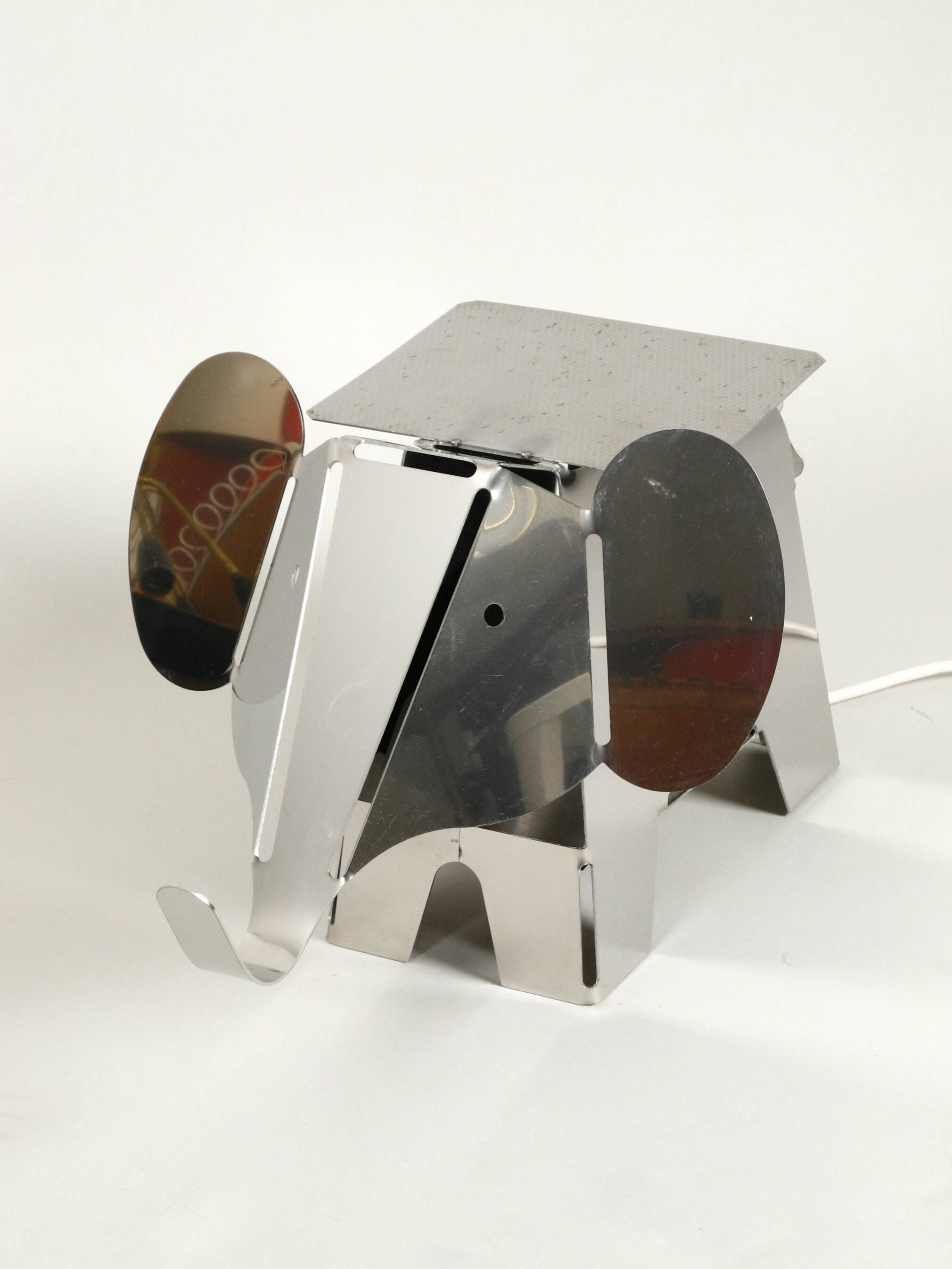 80s heavy metal chrome elephant floor lamp as side table Postmodern design