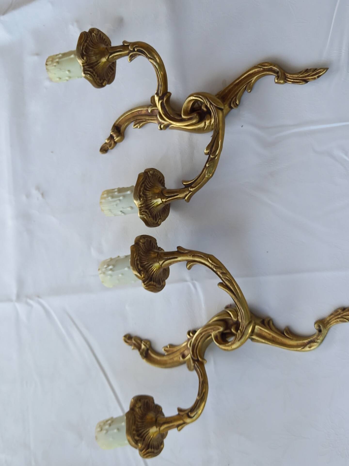 Old pairs of bronze wall sconces