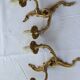 Old pairs of bronze wall sconces